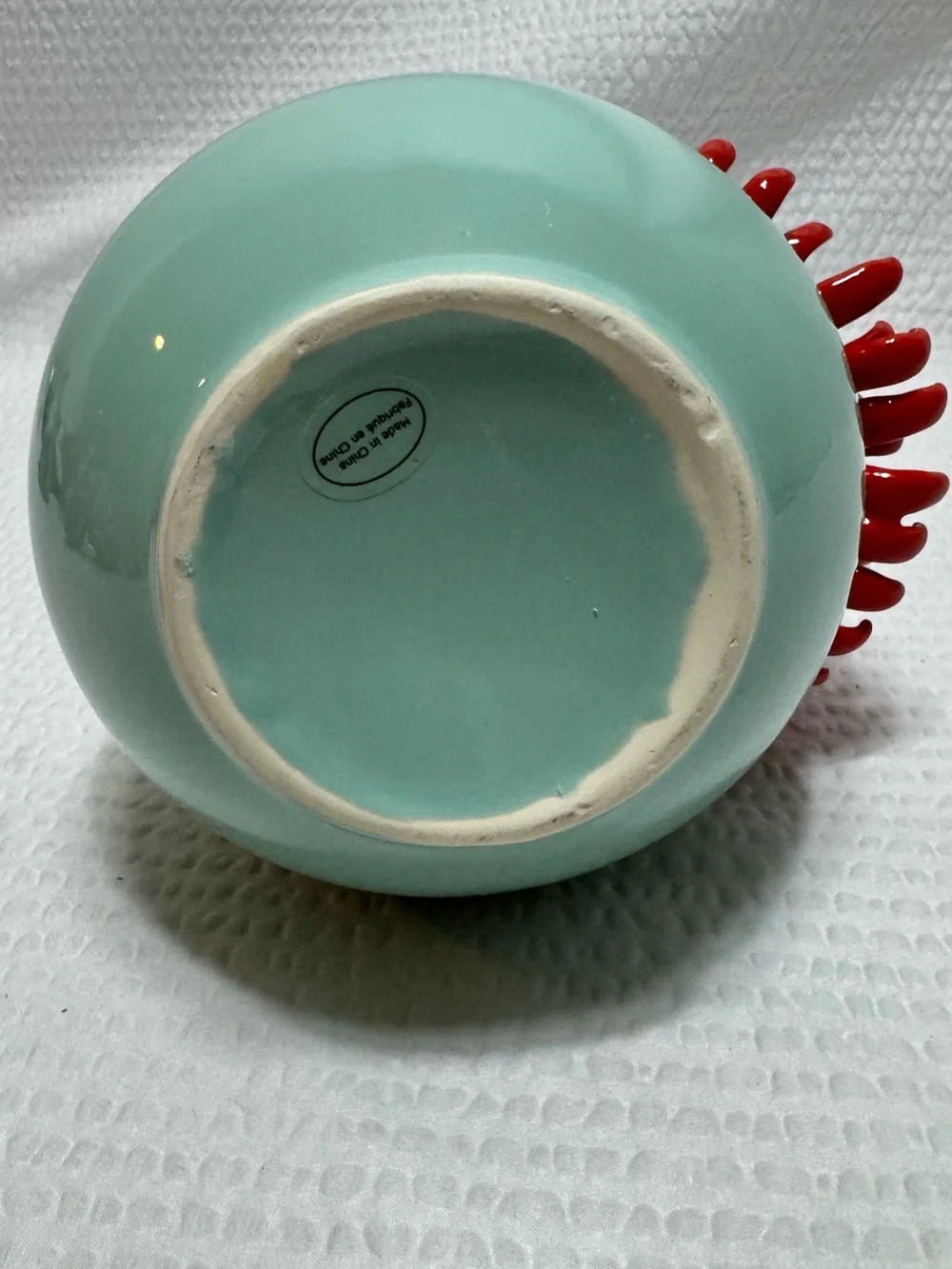Anthropologie Ceramic Vase features a 3D red chrysanthemum bloom against a celad